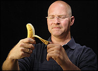 John German, who loves to cook, peels a banana with his i-LIMB hand.