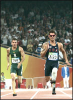 Steven Wilson and Jim Bob Bizzell compete in the 200-meter sprint in Beijing.