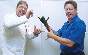 From left: Waldo Esparza, CP, and Roger Thomas flash the "hang-loose" sign. Photograph courtesy of Tampa Bay Prosthetics.