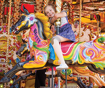 Charlotte on carousel horse