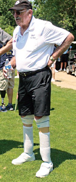 elderly amputee on golf course