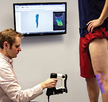 practitioner with hand-held 3D scanner