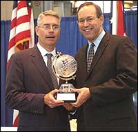 OWW General Manager Ben Elliot (left) receives the 2005 E Award from Ohio Gov. Bob Taft 