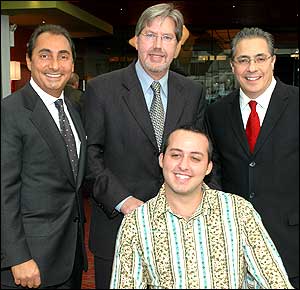 Left to right:  New York State Assemblyman Matthew Mirones, Timothy Evans, certified prosthetist and chief operating officer for Arimed, Steven Mirones, president of Arimed, and seated, Paul Esposito. Arimed is a family-owned firm that was founded in 1949 by Matthew and Steven Mirones' father.