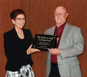 Bob Boff receives plaque commemorating his 42 years of work at PEL.