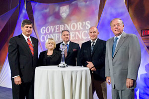 Dennis Williams, president and COO of Fillauer Companies; Fran Jenkins, vice president of Fillauer Companies; and Michael Fillauer, CPO, president of Fillauer LLC were presented the GATE award by Gov. Phil Bredesen, right, and Matt Kisber, left.