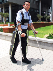 Paralyzed Israeli veteran Radi Kaiof walks in the ReWalk