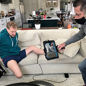 Kennedy receives prosthetic care from Neufeld in his home, saving him time for work and family.