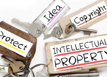 Photo of key bunch and paper tags with INTELLECTUAL PROPERTY conceptual words